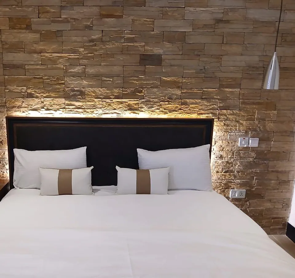Single Room category with a made bed